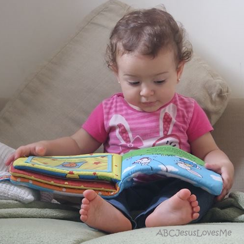 Little girl reading a book.