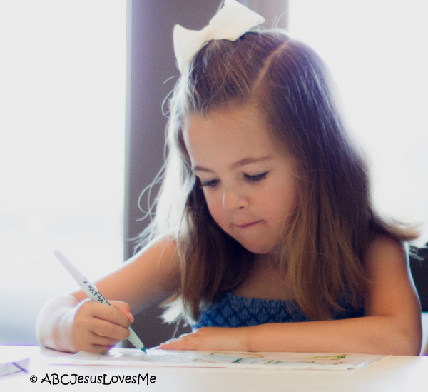 Little girl working on handwriting.