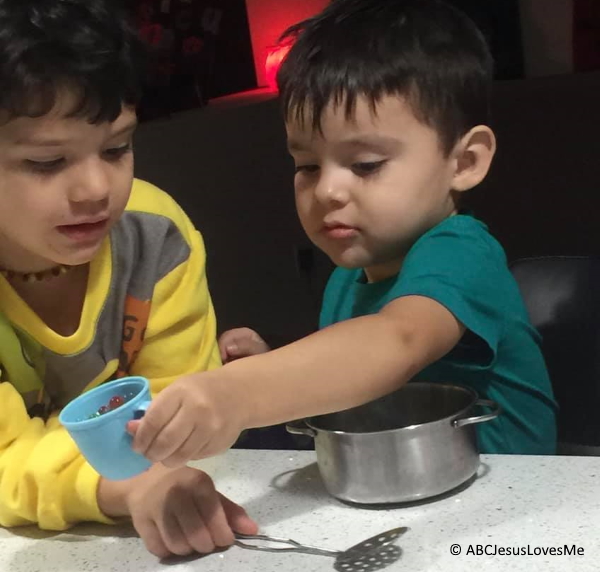 Two boys making cookies