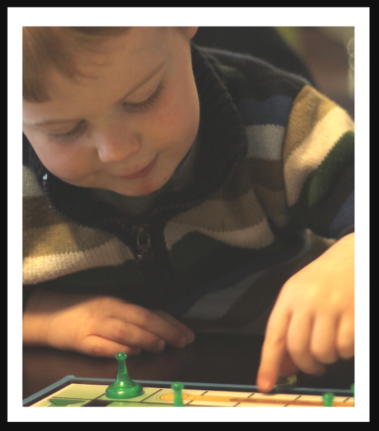 Little boy playing a game.