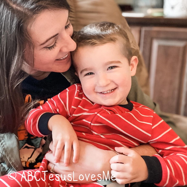 Mom giving her son a hug.