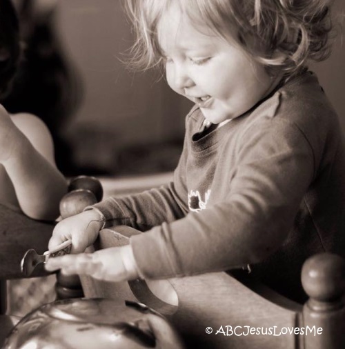 Little girl playing instruments.