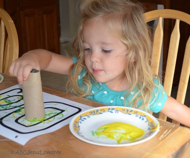Little girl painting.