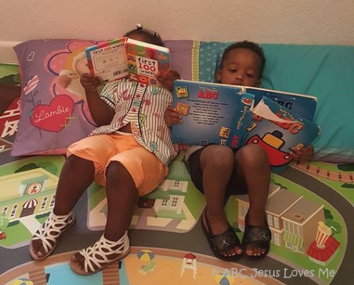 Children reading together on the floor.