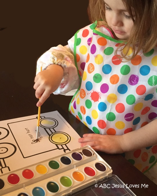 Child painting with watercolors