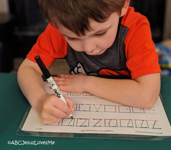 Child writing letters.